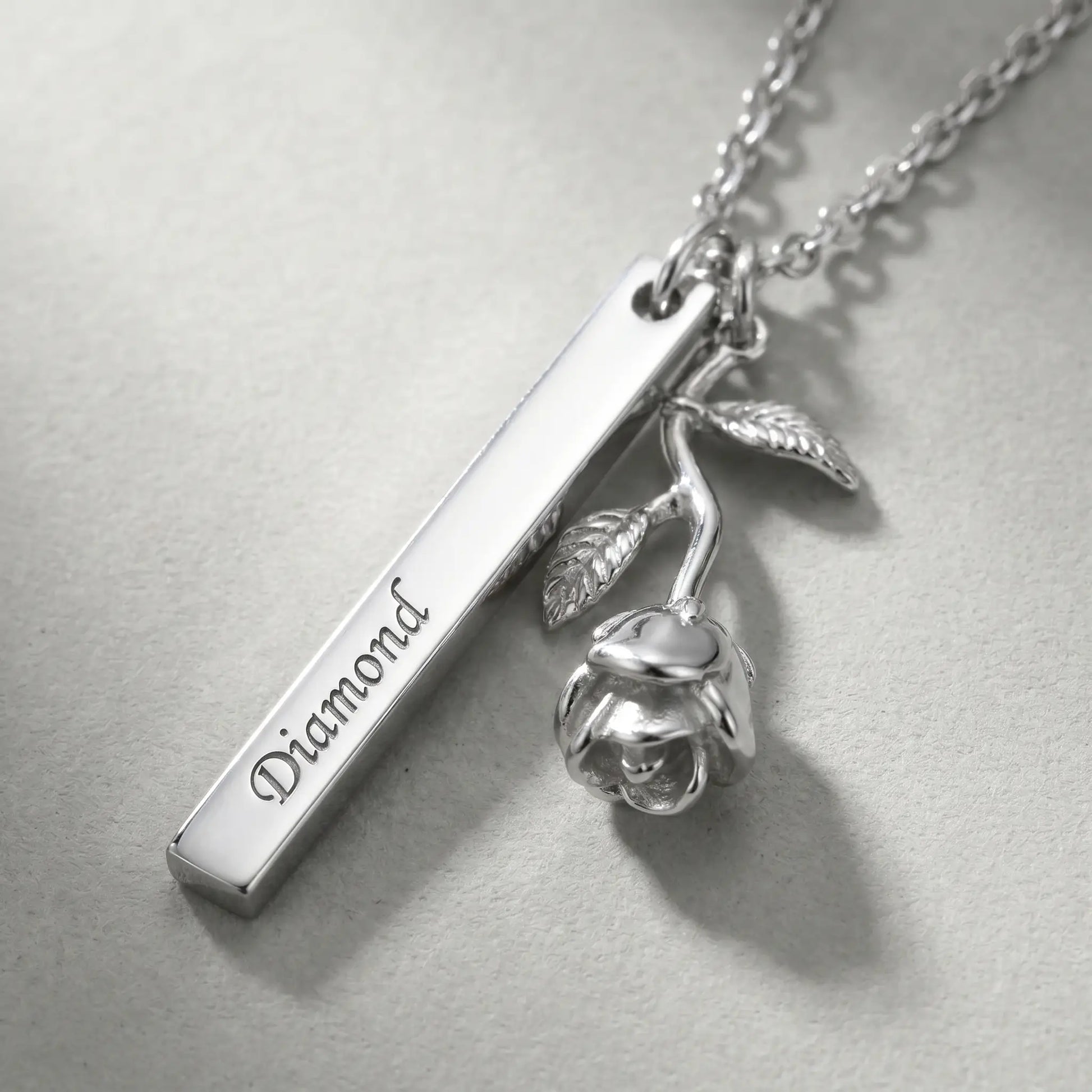 Rose Gold Engraved Bar Pendant in silver tone macro detail Diamond engraving and rose flower