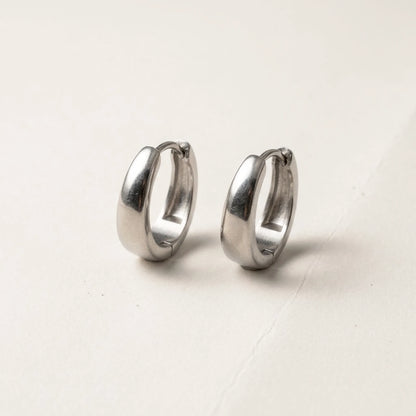 Silver tone stainless steel chunky dome hoop earrings, product shot on white | SKU: AUR-CHKDOM-S