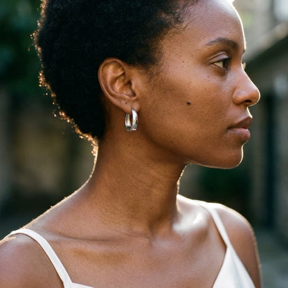 Silver tone stainless steel chunky dome hoop earrings, worn, side profile | SKU: AUR-CHKDOM-S