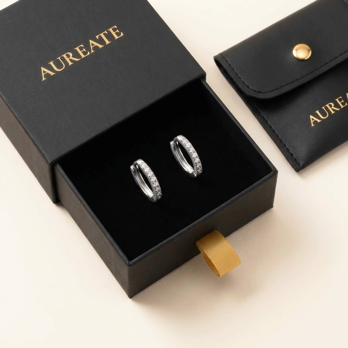 Silver tone stainless steel pave huggie hoop earrings, in its gift box | SKU: AUR-PVHUGG-S