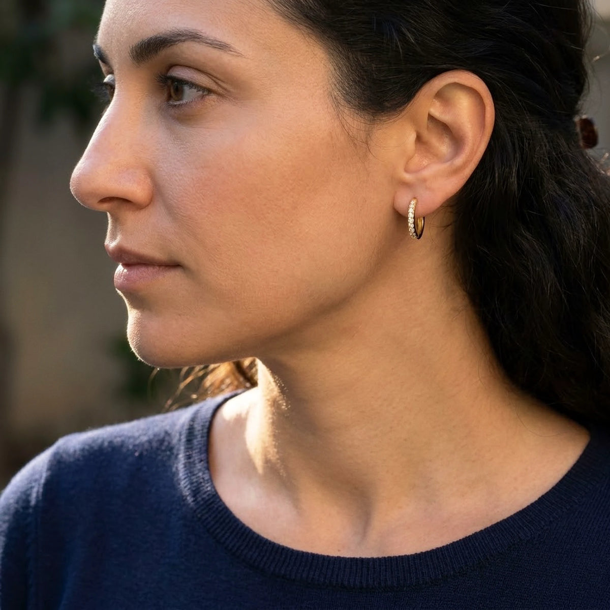 Silver tone stainless steel pave huggie hoop earrings, worn, side profile | SKU: AUR-PVHUGG-S