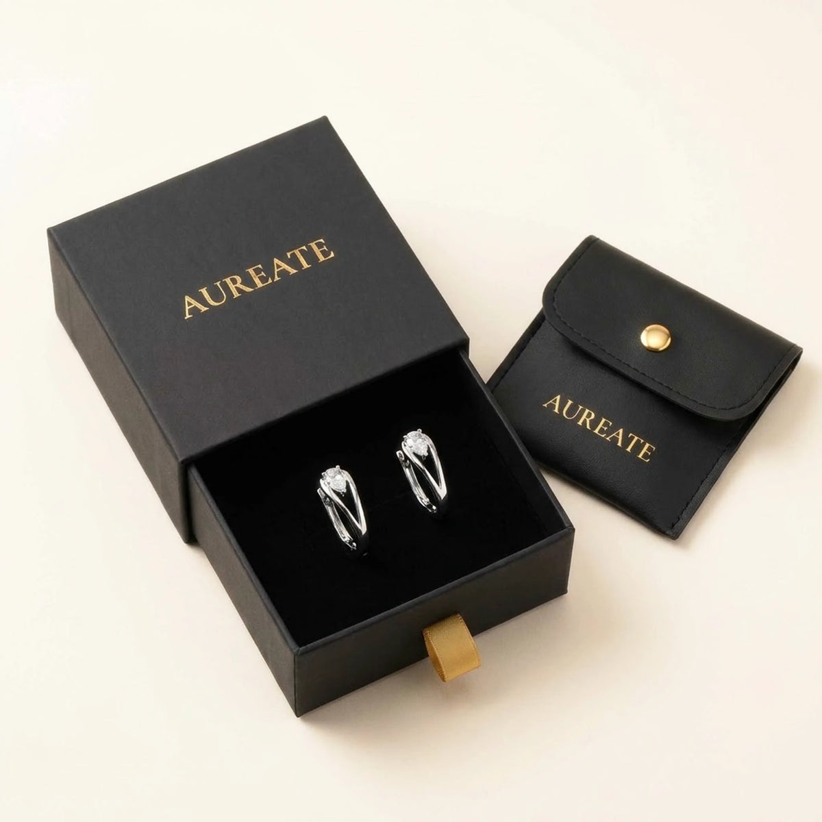 Silver tone stainless steel pear cut crystal huggie hoop earrings, in its gift box | SKU: AUR-PRCZHG-S