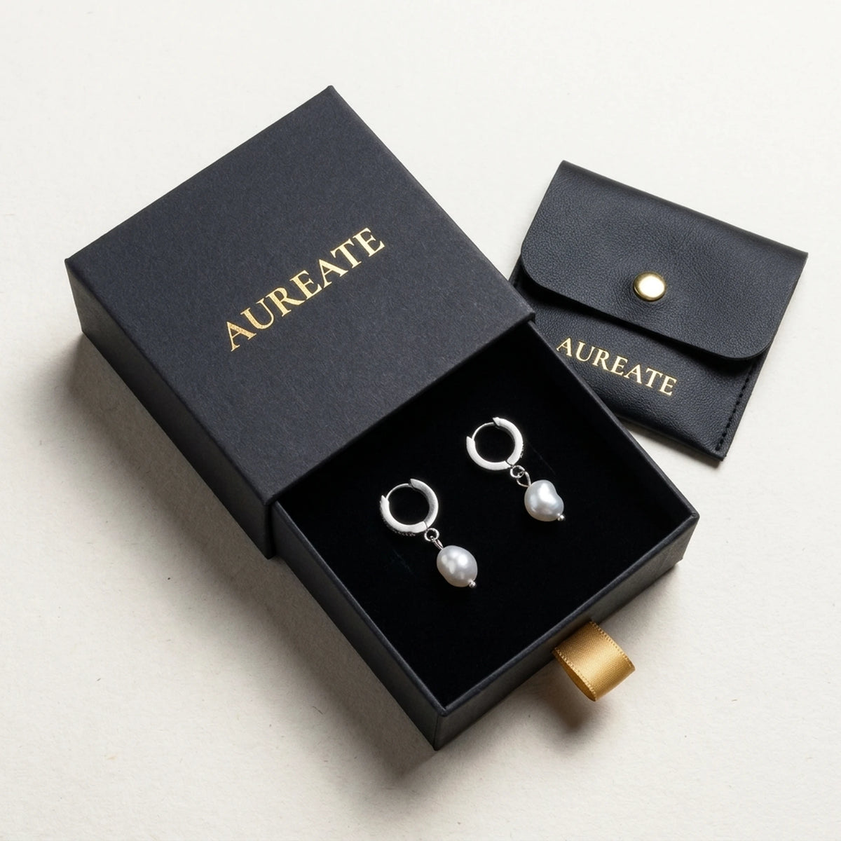 Silver tone stainless steel freshwater pearl drop huggie earrings, in its gift box | SKU: AUR-PRLHUG-S
