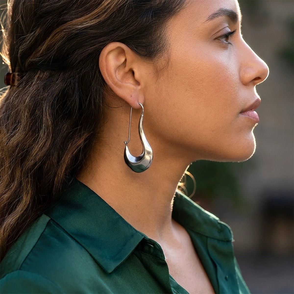 Silver tone stainless steel sculpted crescent drop earrings, worn, side profile | SKU: AUR-SCPCRS-S