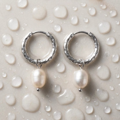 Silver tone stainless steel twisted rope pearl drop hoop earrings, still life on a wet surface, waterproof | SKU: AUR-TWPRLH-S