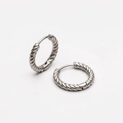 Silver tone stainless steel twisted rope huggie hoop earrings, product shot on white | SKU: AUR-TWRHUG-S