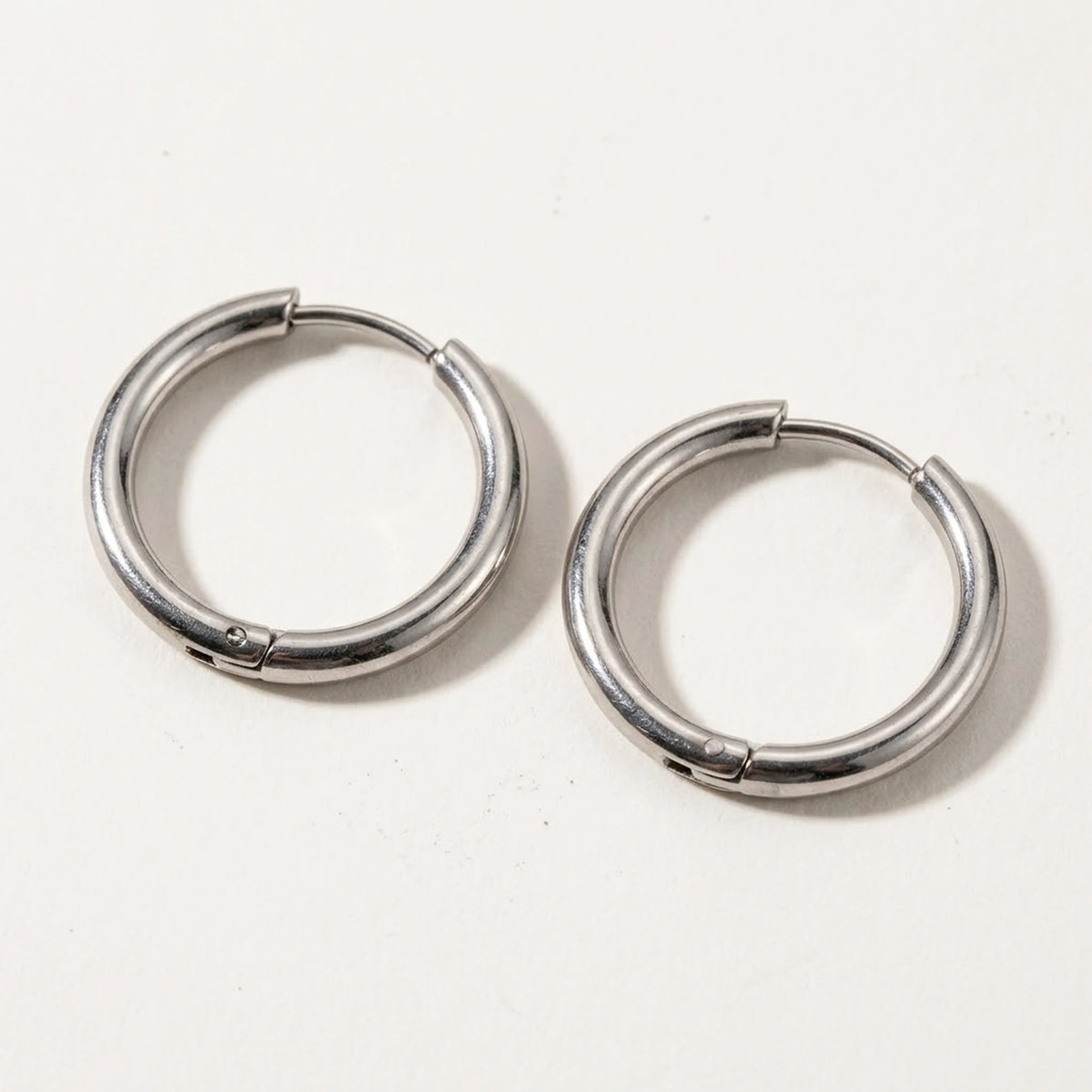 Silver tone stainless steel waterproof hoop earrings, product shot on white | SKU: AUR-CLSHOP-S