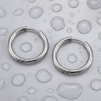 Silver tone stainless steel waterproof hoop earrings, still life on a wet surface, waterproof | SKU: AUR-CLSHOP-S