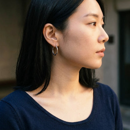Silver tone stainless steel waterproof hoop earrings, worn, side profile | SKU: AUR-CLSHOP-S
