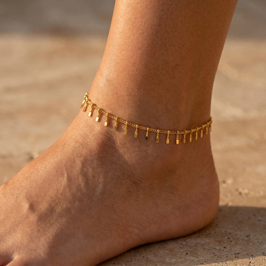 Gold Sun Ray Fringe Anklet worn on dorsal ankle close-up