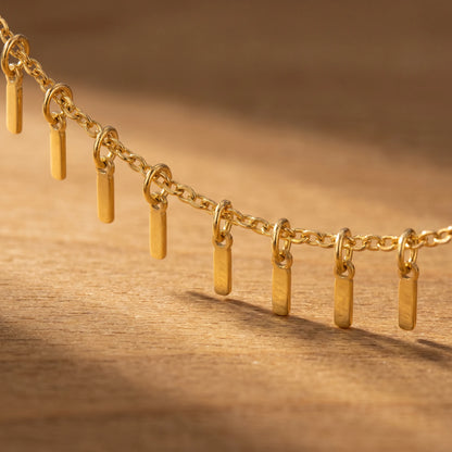 Gold Sun Ray Fringe Anklet macro detail of fringe bars