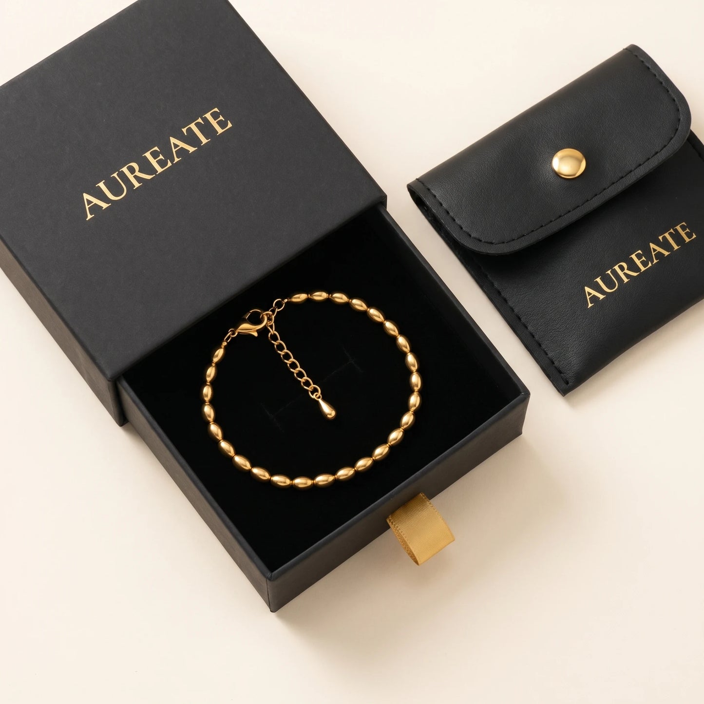 Gold oval bead anklet in AUREATE gift box with leather pouch