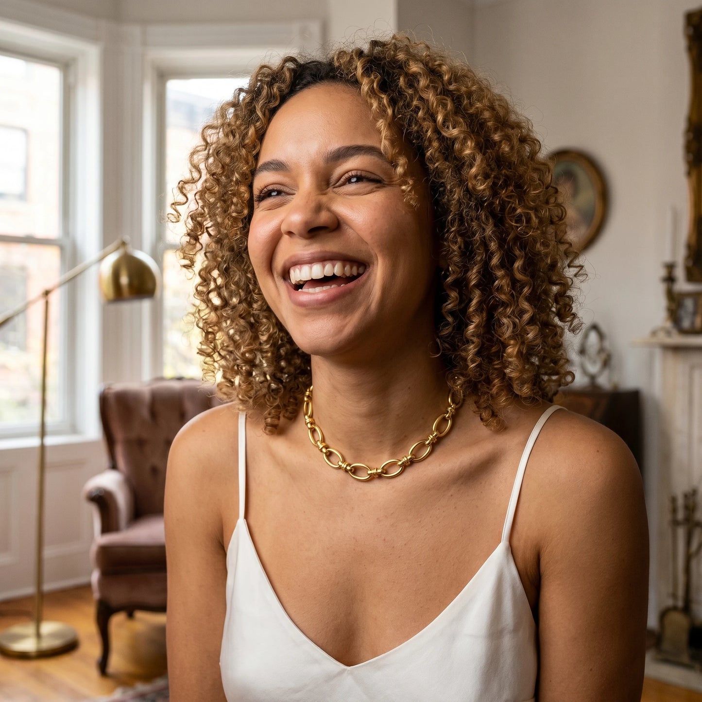 Vintage rolo necklace gold candid joy laugh in antique Brooklyn brownstone