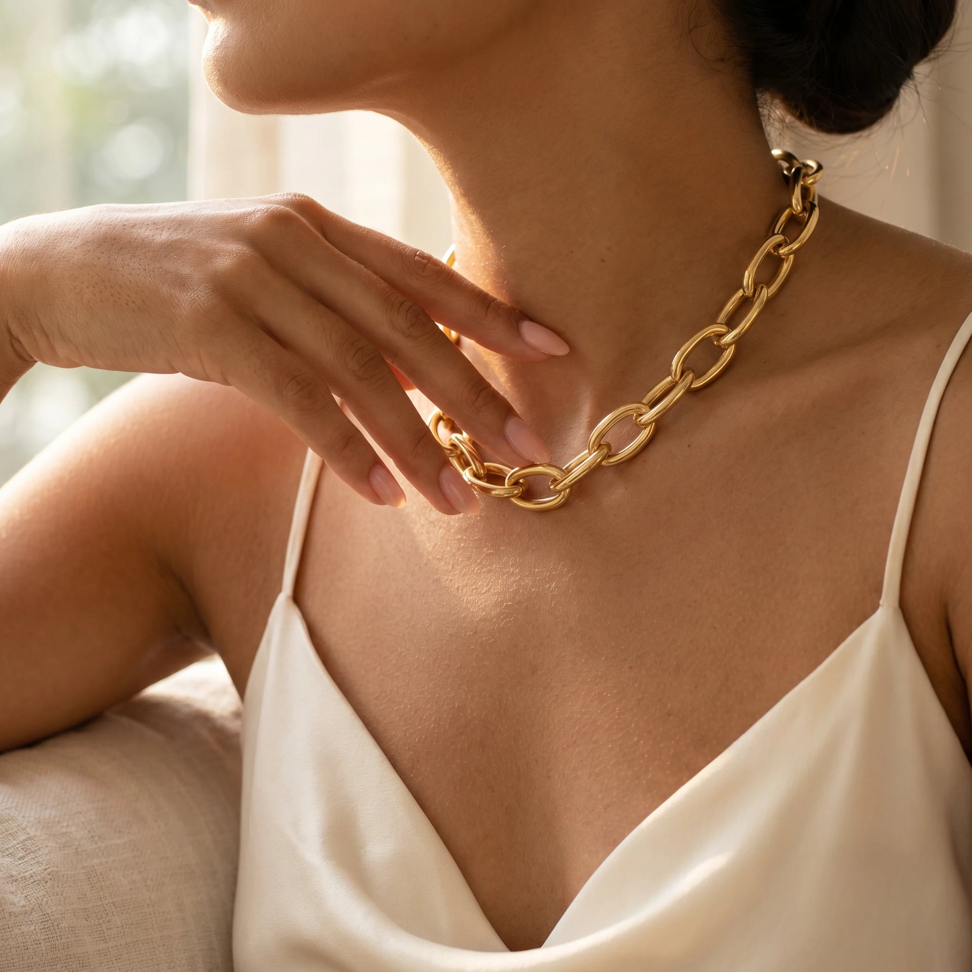 Chunky gold statement necklace XL oval cable chain fingertips intimate close-up